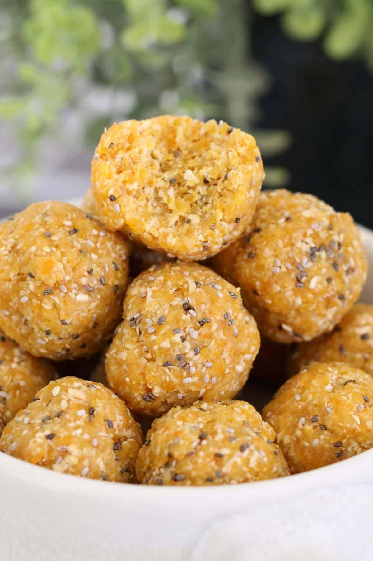 A close up of a pile of healthy protein balls with chia seeds.