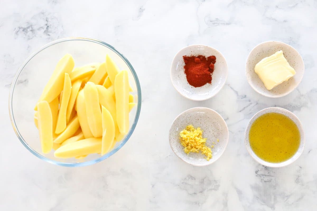 The ingredients for crunchy lemon and paprika wedges.