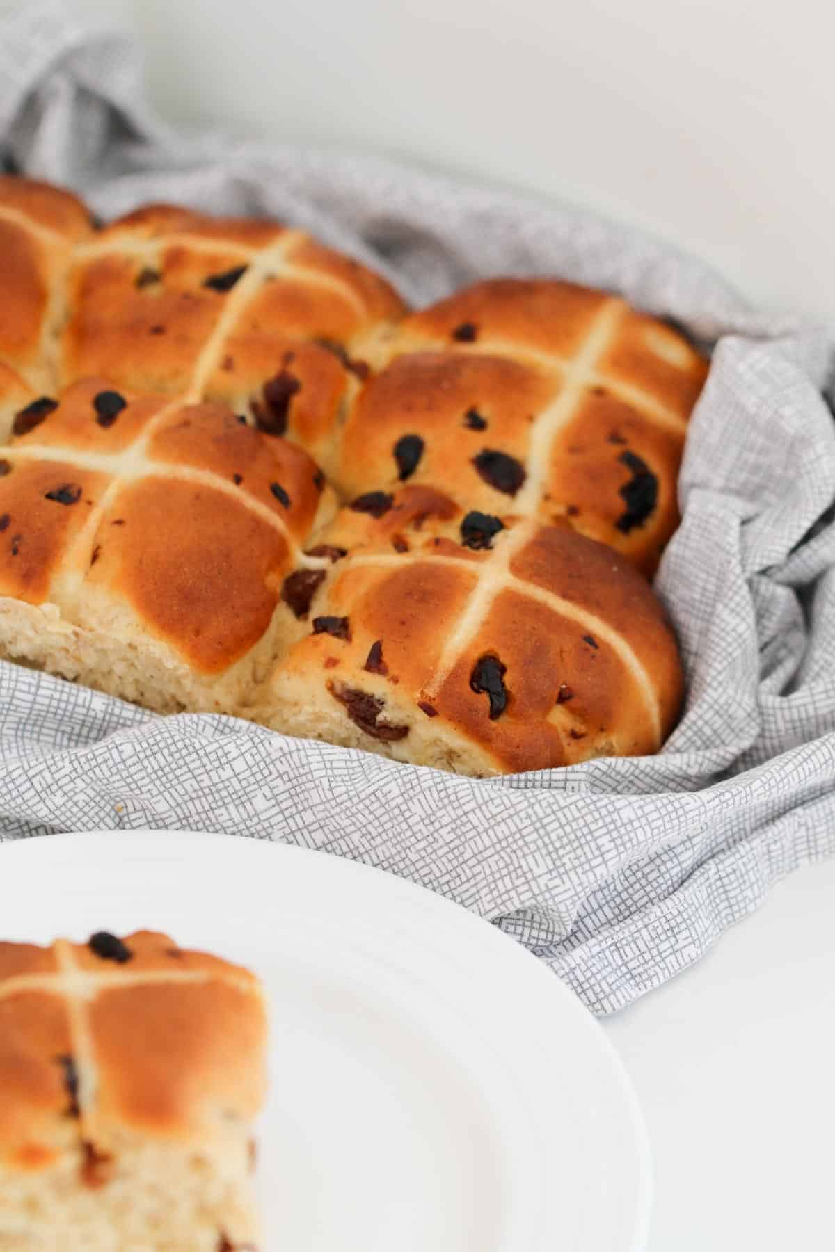 White crossed piped on to fruit hot cross buns.
