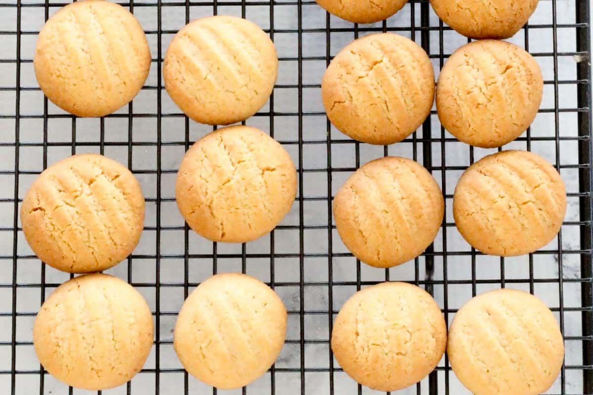 Baked coconut cookies cooling on a wire rack