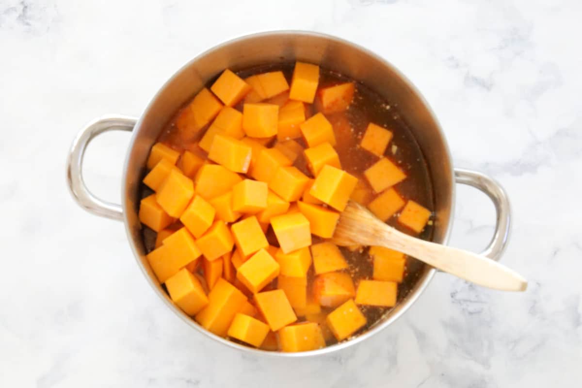 diced pumpkin and vegetable stock in a large pot