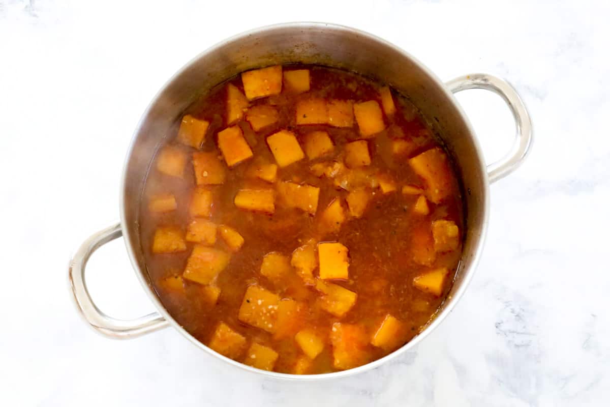 cooked pumpkin in stock in a large pot