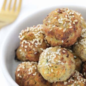 A batch of healthy turkey meatballs in a white serving dish.