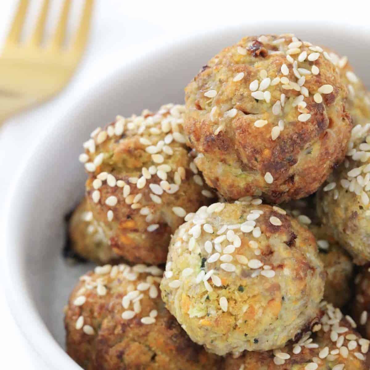 A batch of healthy turkey meatballs in a white serving dish.