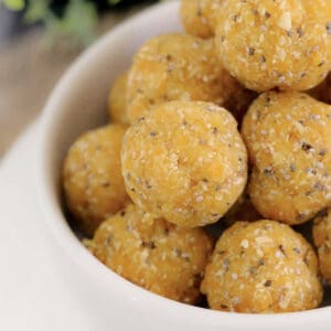 A bowl of apricot bliss balls with chia seeds.