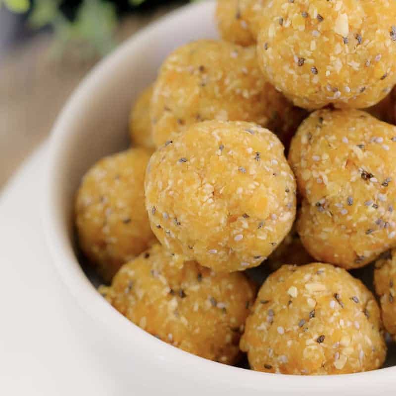 A bowl of apricot bliss balls with chia seeds.