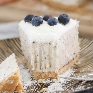 a slice of cheesecake with a bite missing