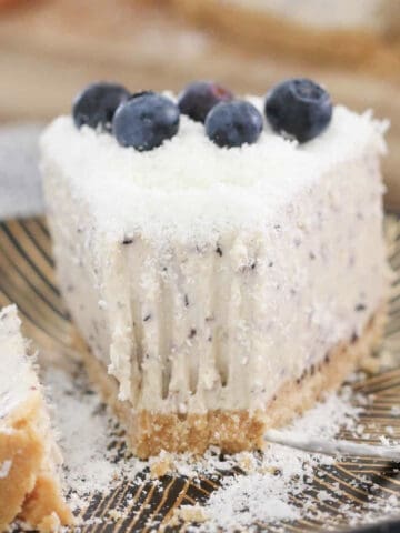 a slice of cheesecake with a bite missing