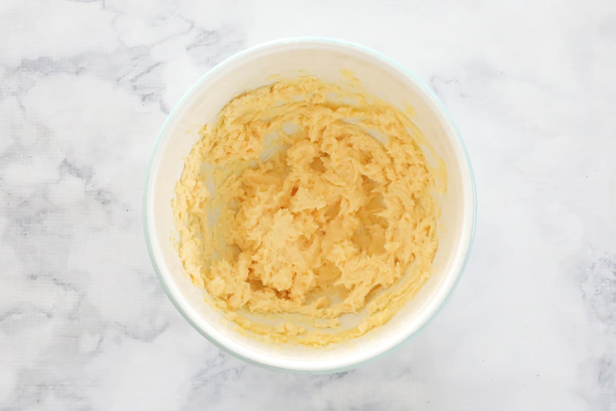 Yellow sponge cake mixture in a bowl.