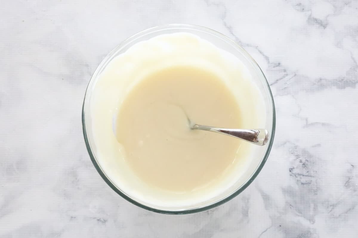 Sweetened condensed milk mixture in a bowl.