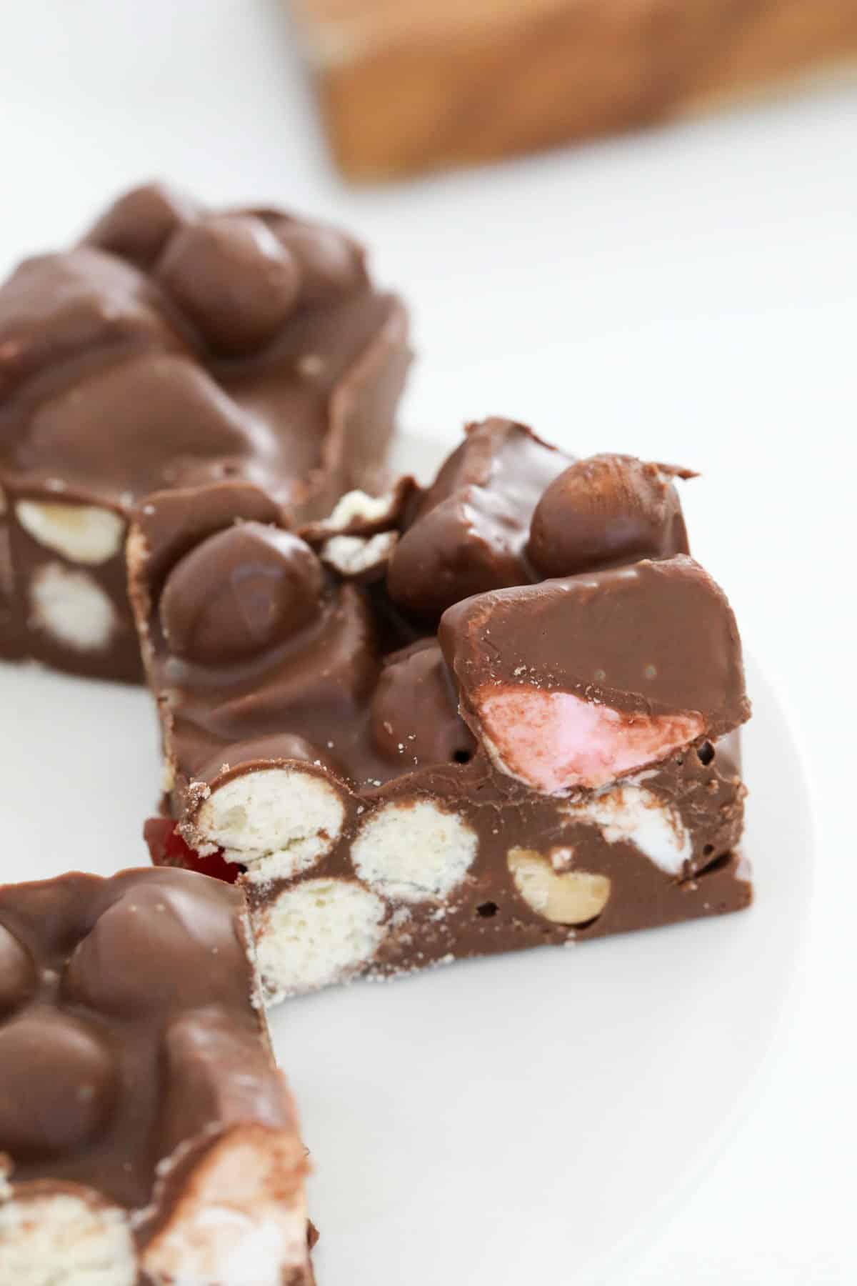 Malteser slice with marshmallows and raspberry lollies.