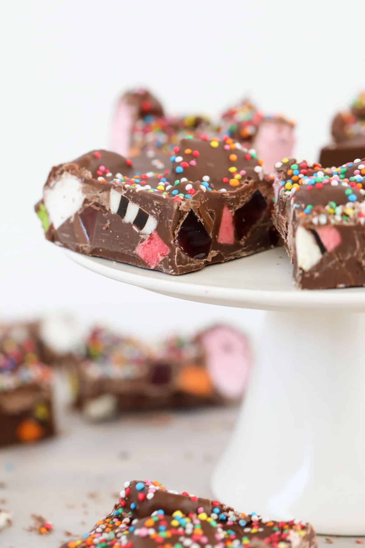 A cross section of licorice allsorts rocky road with sprinkles