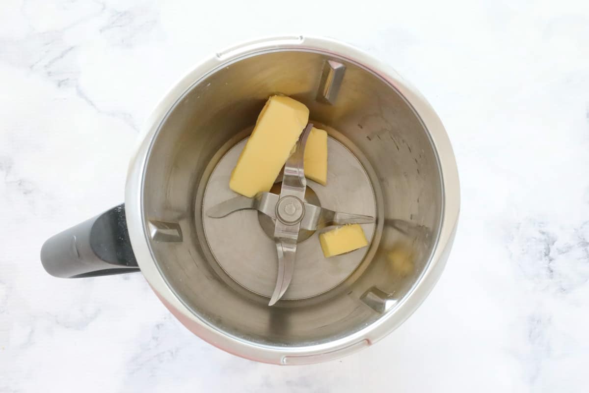 Chopped butter in a stainless jug.