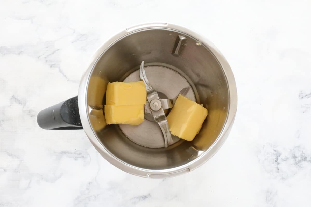 Chopped butter in a Thermomix jug.