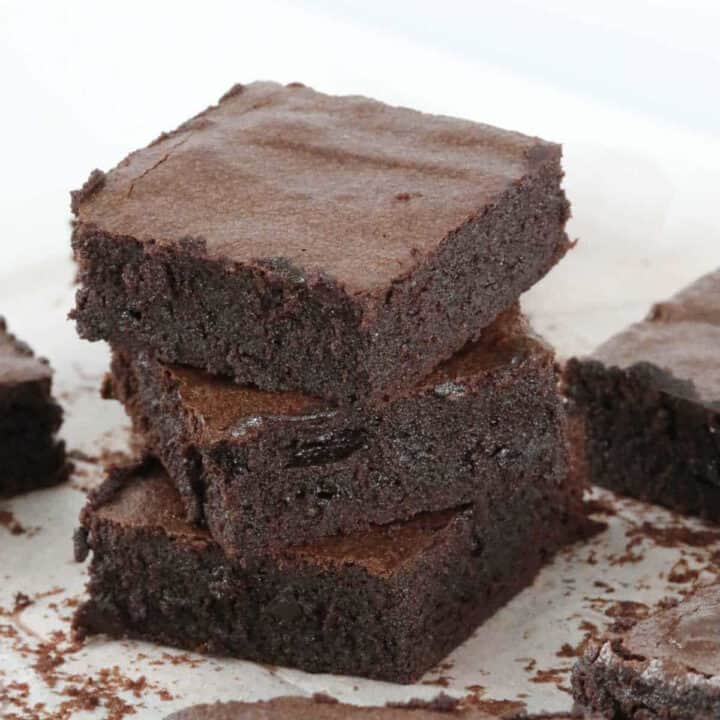 A stack of 3 pieces of fudgy chocolate brownies.