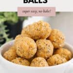 A small white bowl full of Apricot Bliss Balls.