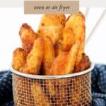 A silver basket filled with crunchy potato wedges.