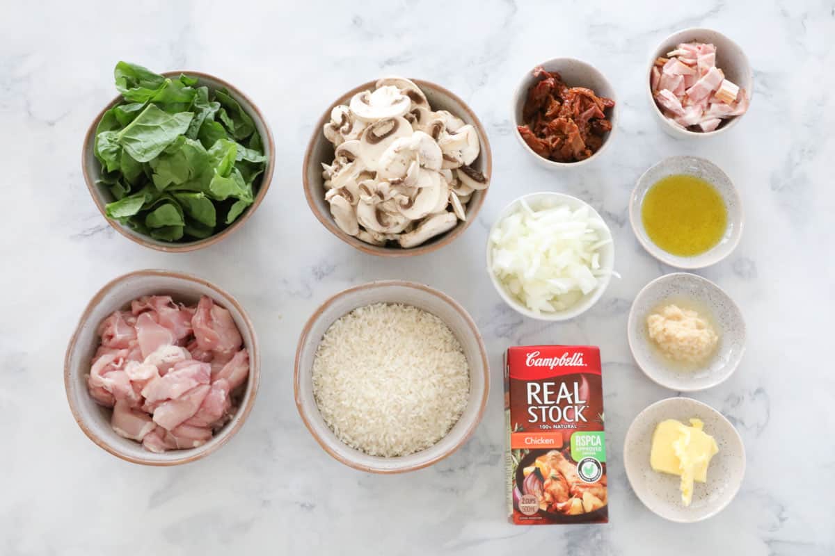 All ingredients for slow cooker risotto laid out on a table