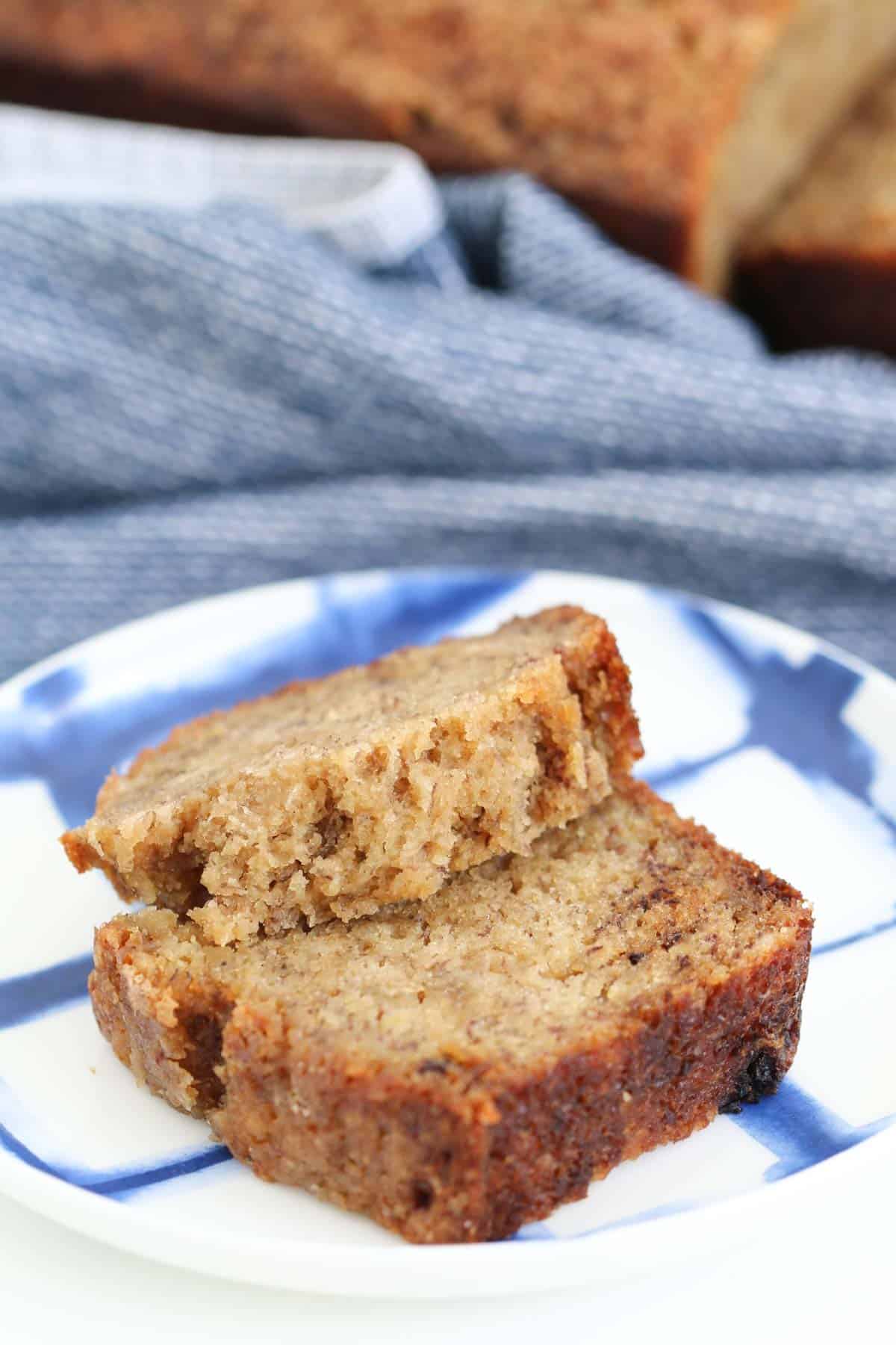 A close up of pieces of banana loaf on a blue and white plate.