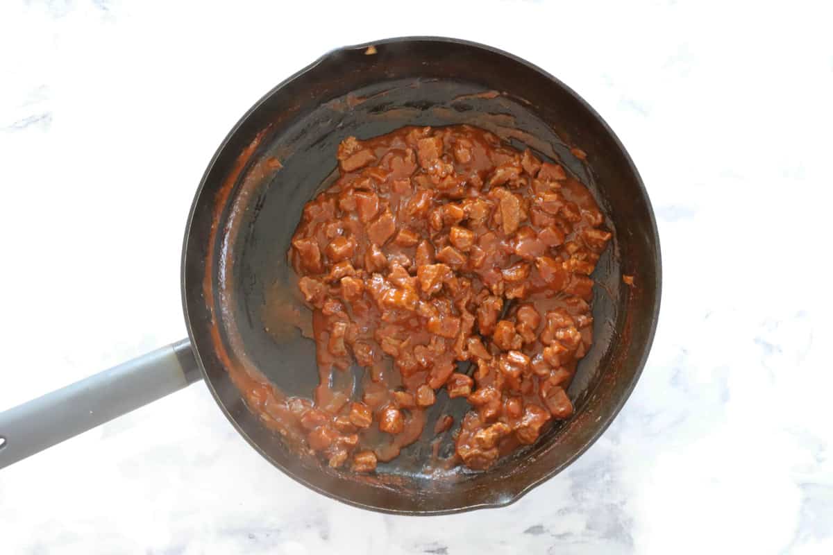 Chunky beef filling for pies, in a frying pan