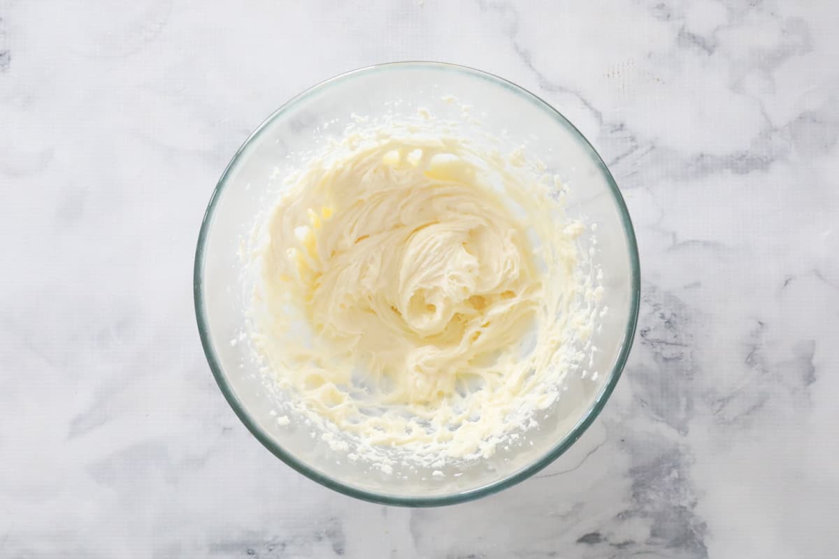 Cream cheese mixture in a glass bowl.