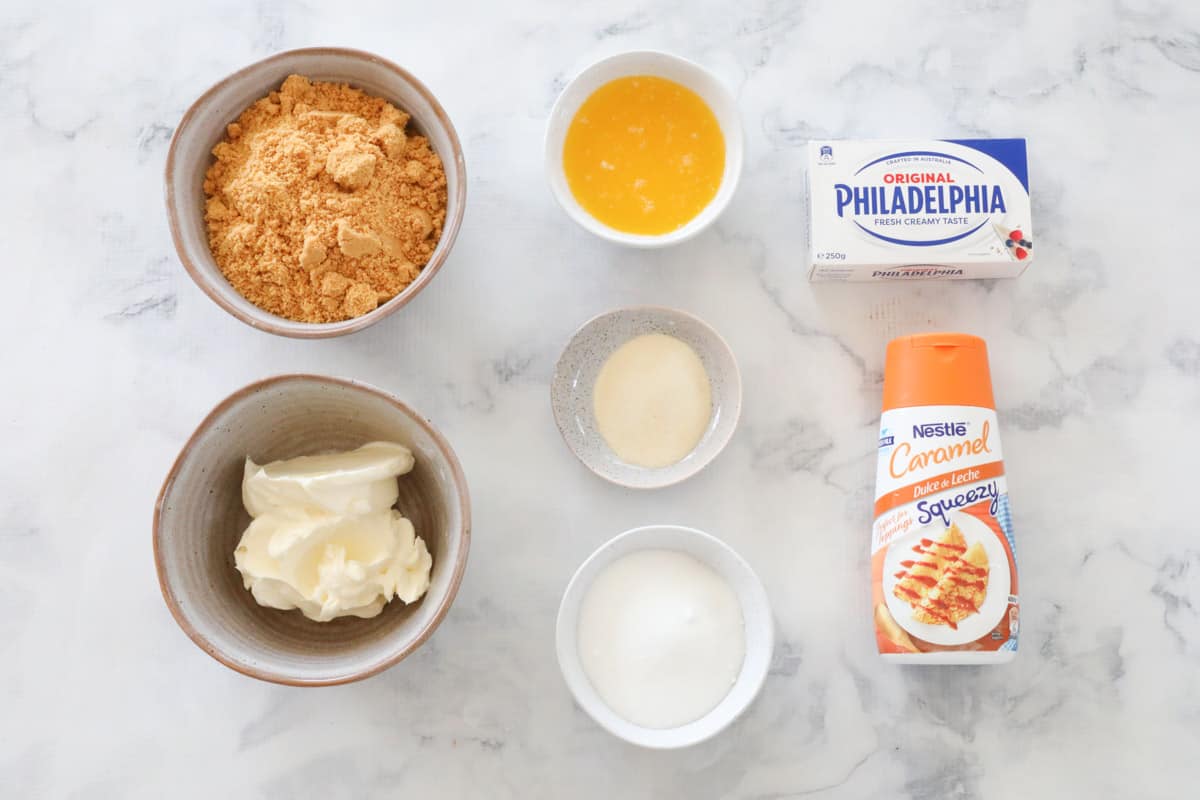 The ingredients needed for caramel cheesecake bars.