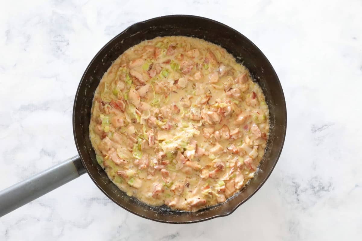 Chicken and leek pie filling in a pan