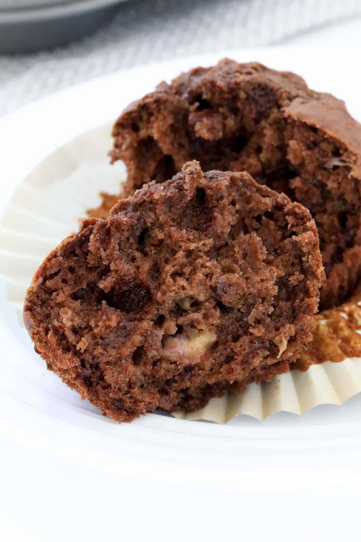 A double chocolate muffin split in half to show the texture inside.