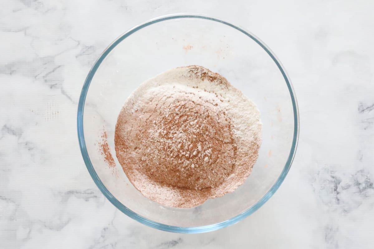 Sifted flour and cocoa powder in a bowl.