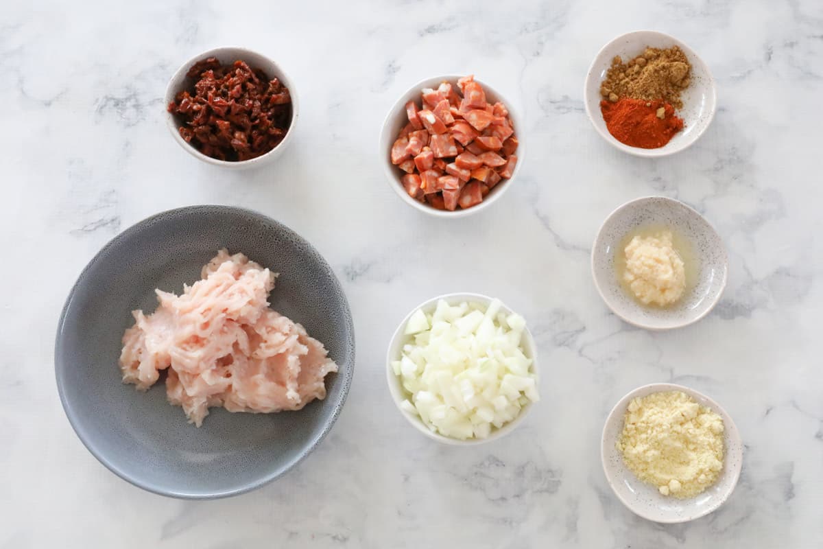 all ingredients for chicken empanada filling, laid out on a table