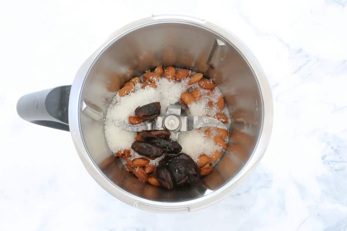 Almond and date base ingredients in a thermomix bowl.
