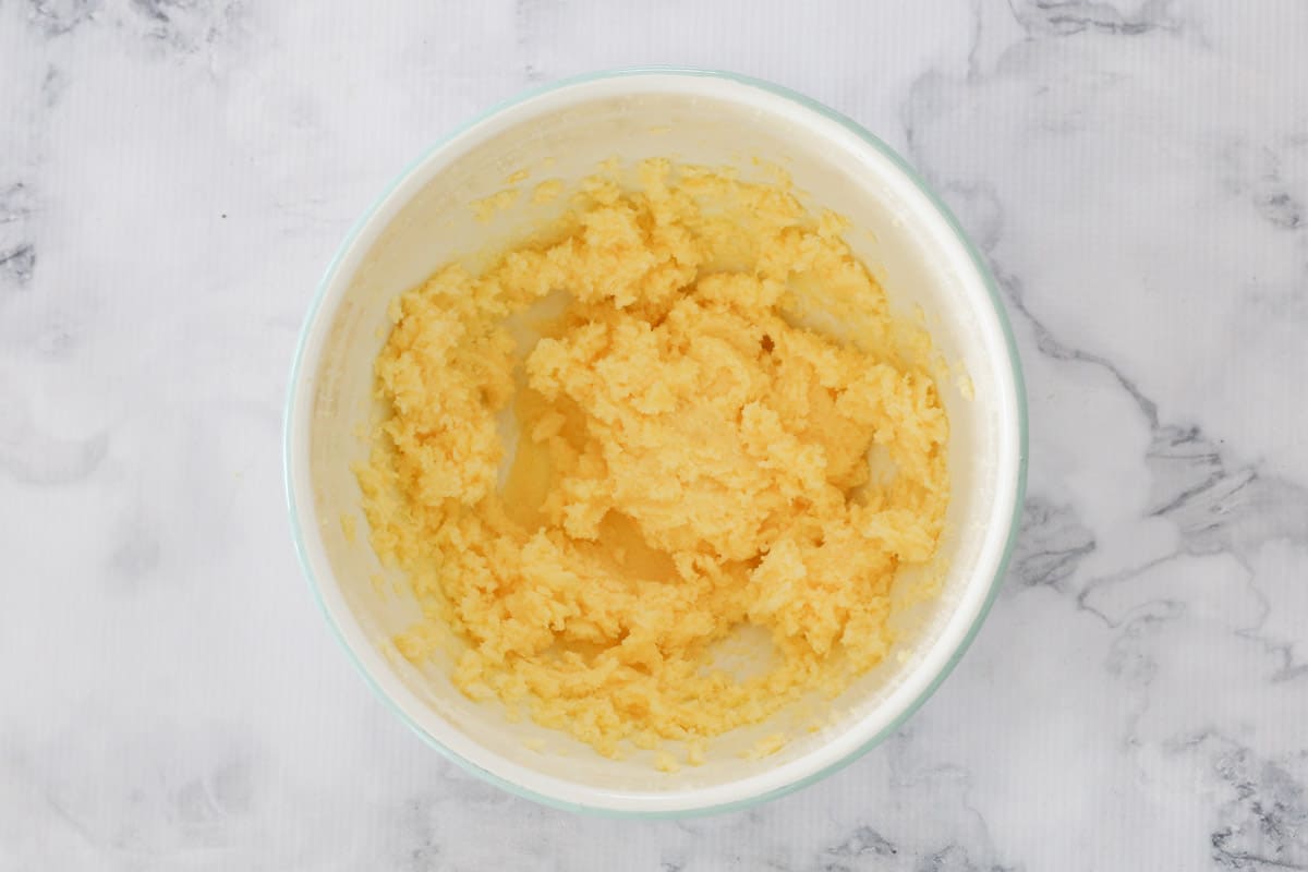 Creamed butter and sugar mixture in a bowl.