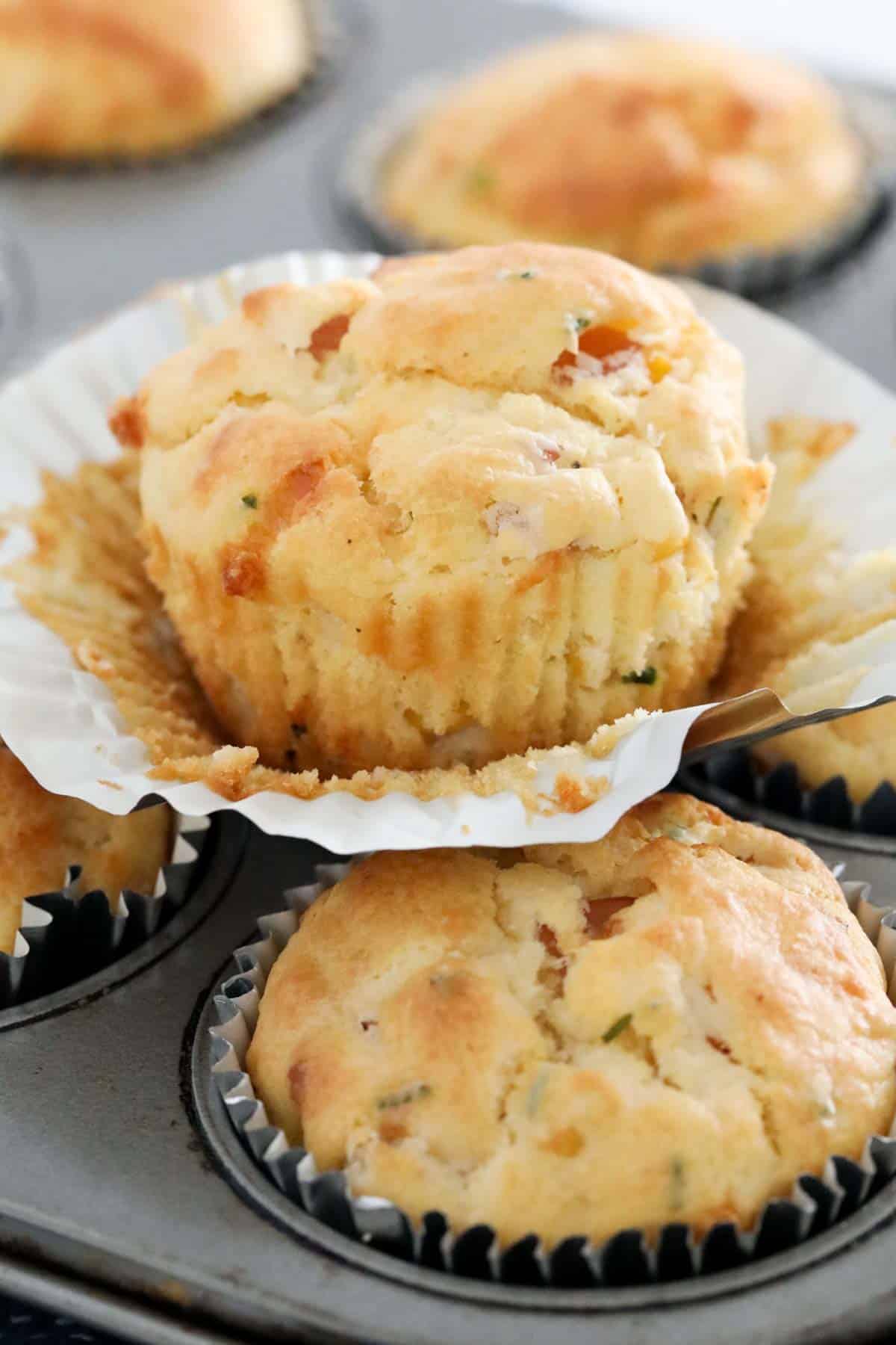 A close up of a batch of savoury muffins.
