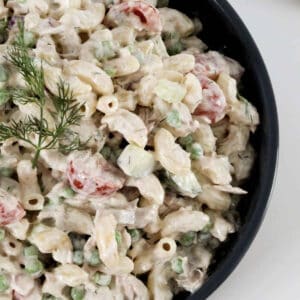A bowl of creamy pasta salad with tuna.