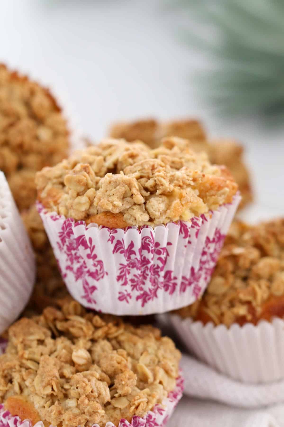A close up of crunchy crumble on top of a muffin.