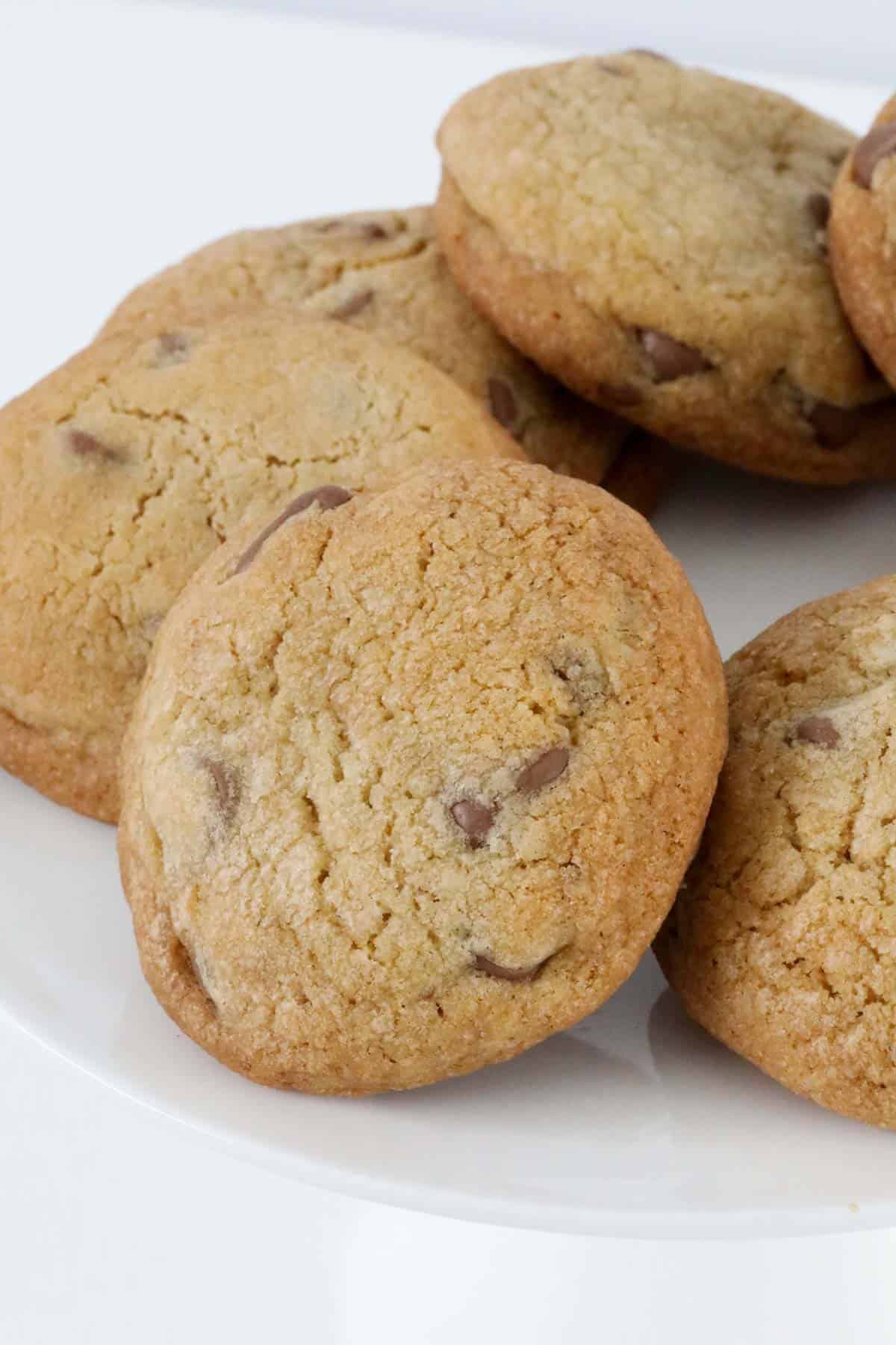 A baked cookie with chocolate chips throughout.
