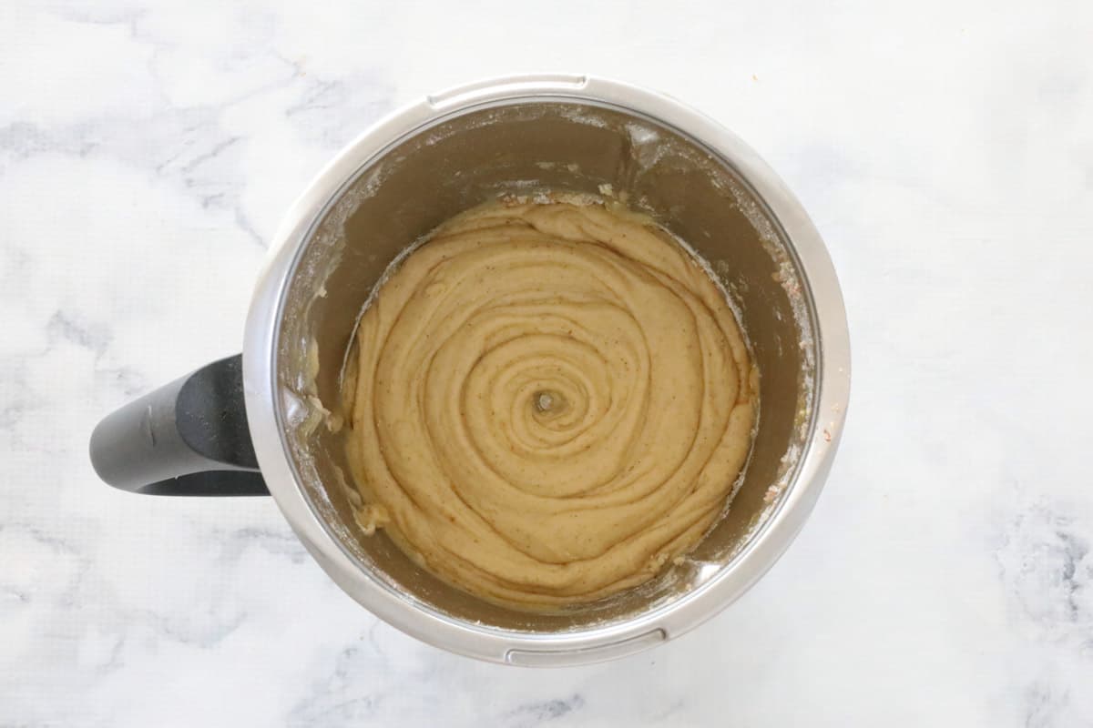 Creamy mixture in a stainless Thermomix jug.