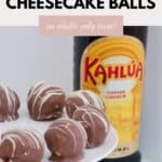 Chocolate coated balls on a white cake stand, with a bottle of Kahlua in the background.