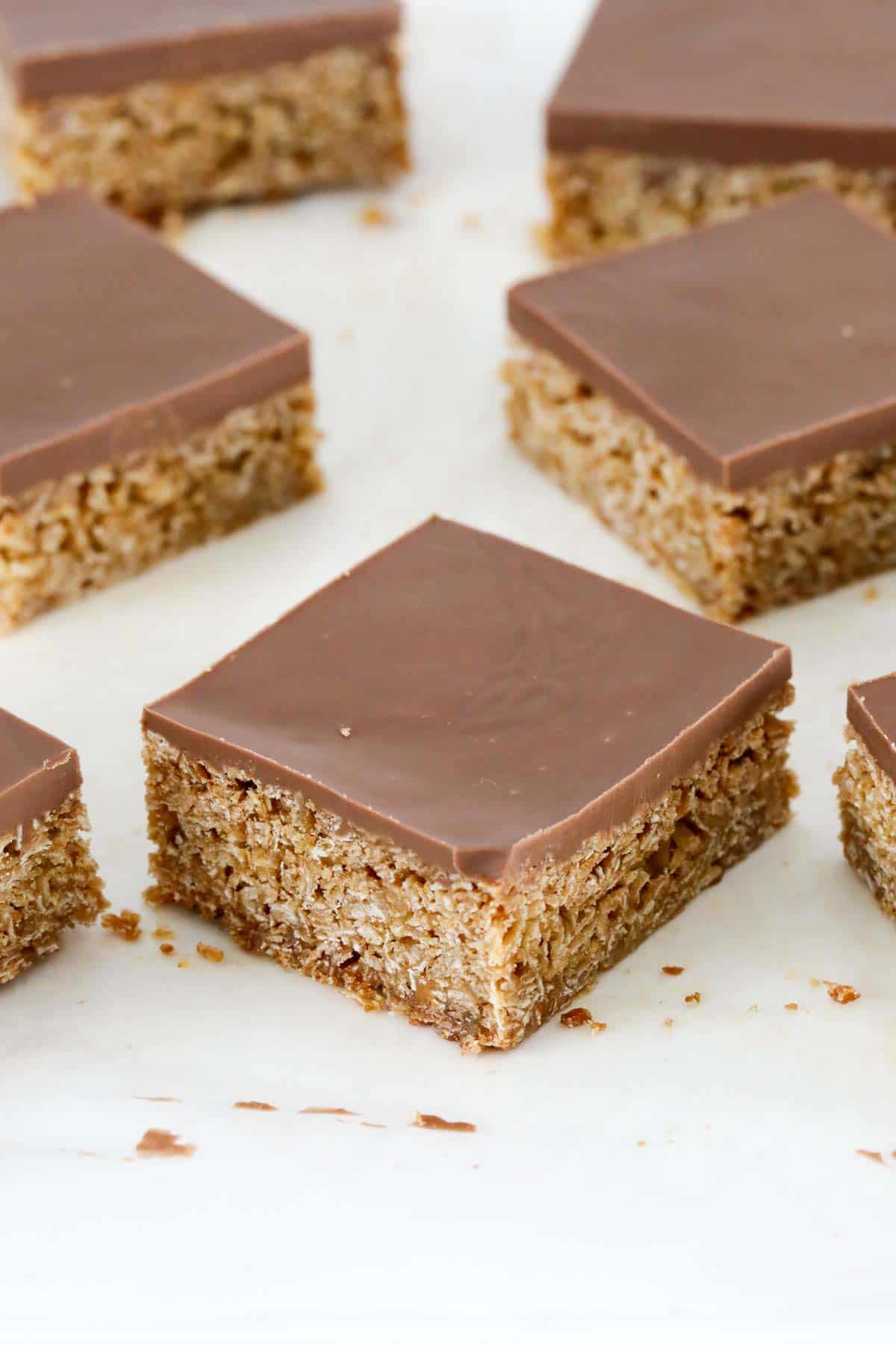 Chocolate flapjacks with chocolate on top, cut into squares.