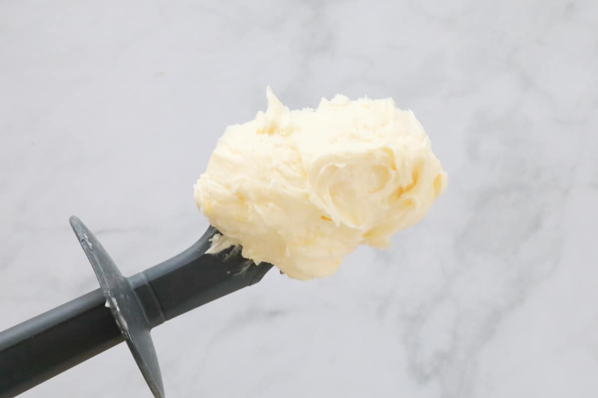 Lemon buttercream on a spatula.