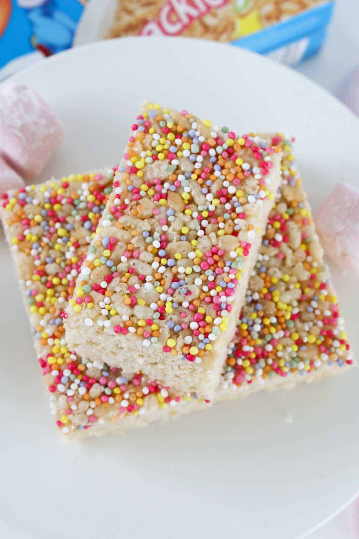 An overhead shot pf pieces of rice crispy slice with sprinkles on top.