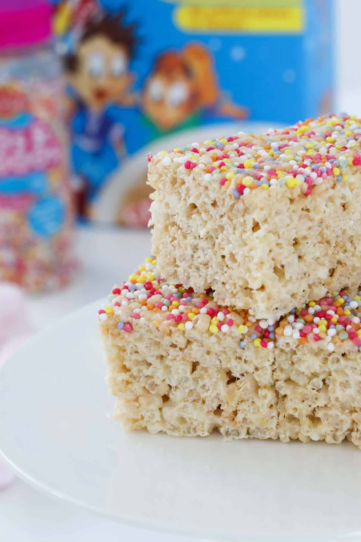 Homemade LCM bars with sprinkles on top in front of a packet of rice bubbles.