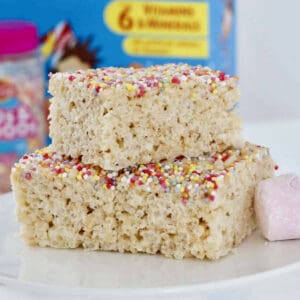 A stack of 3 pieces of marshmallow slice with puffed rice.