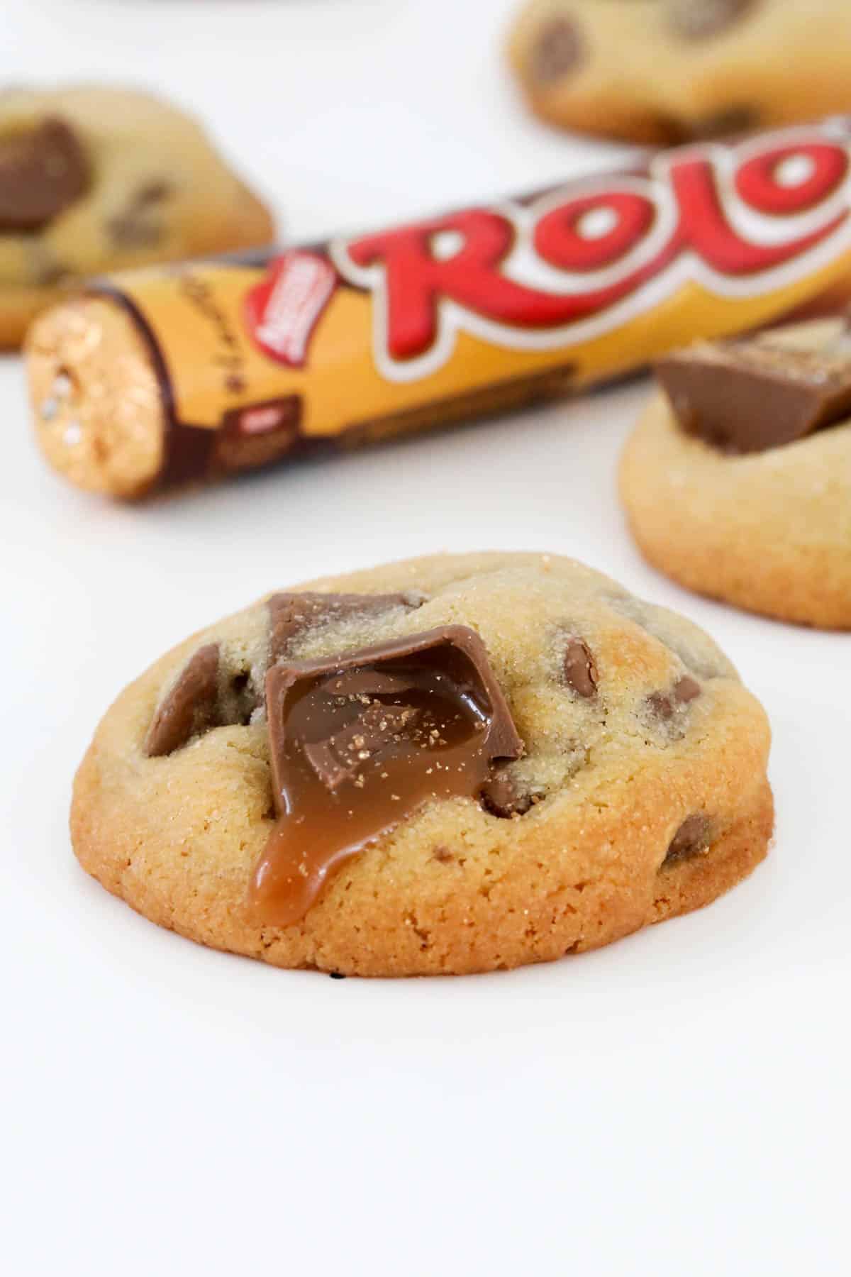 Chocolate chip cookies with gooey chocolate caramels spilling out.