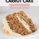 A slice of carrot cake layered with cream cheese frosting.