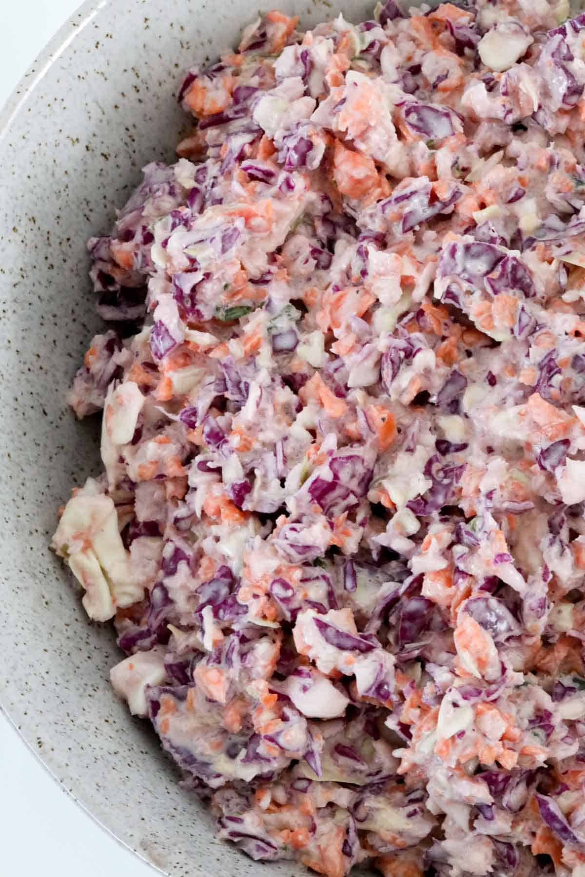 An overhead shot of a bowl of colourful coleslaw.