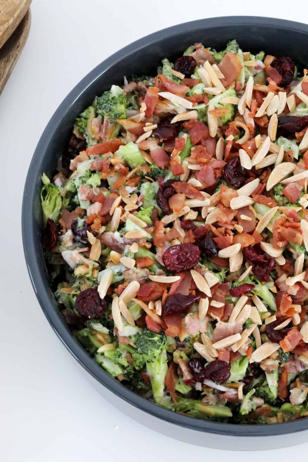 Toasted slivered almonds and dried cranberries scattered through a healthy salad.