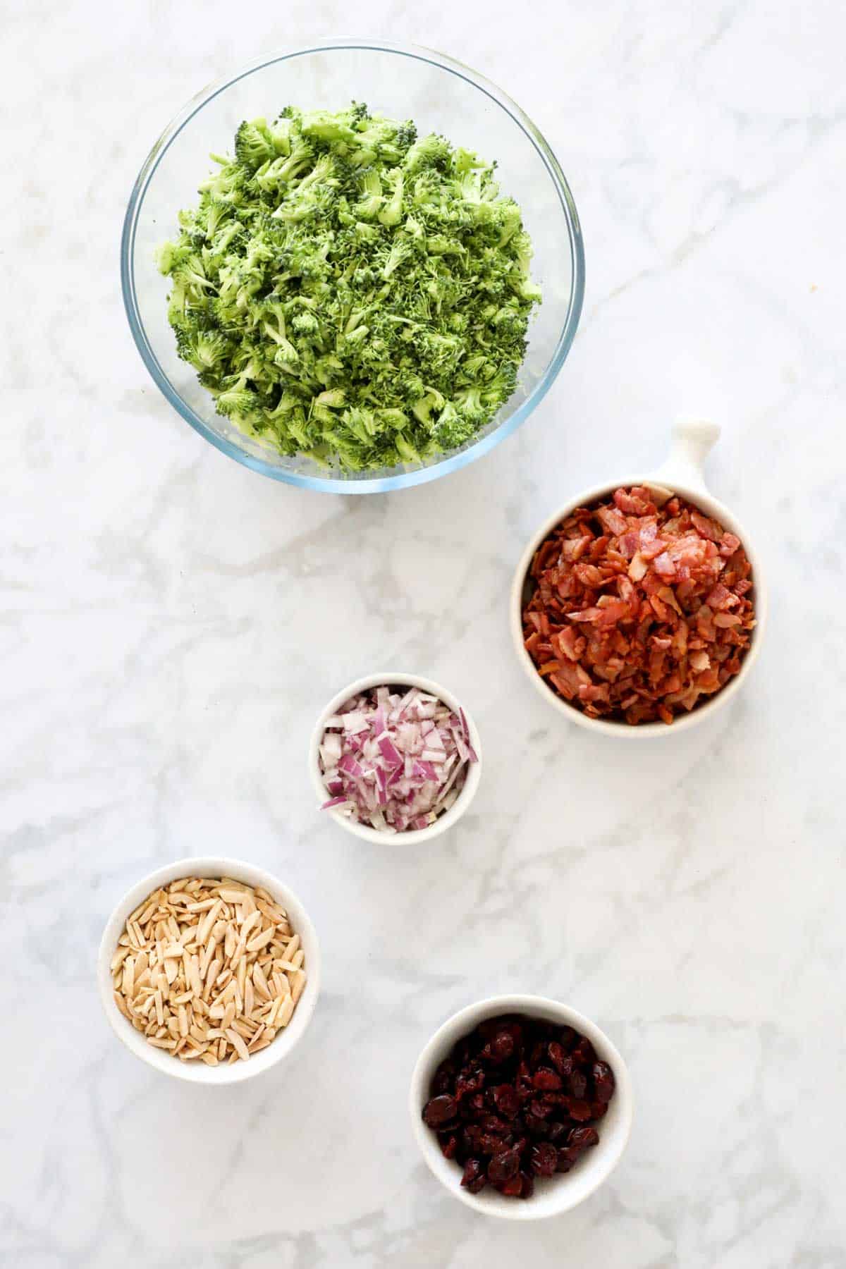 4 ingredients for making a crunchy salad in individual bowls.