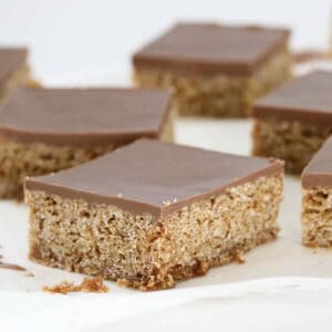 Pieces of oat slice topped with chocolate.