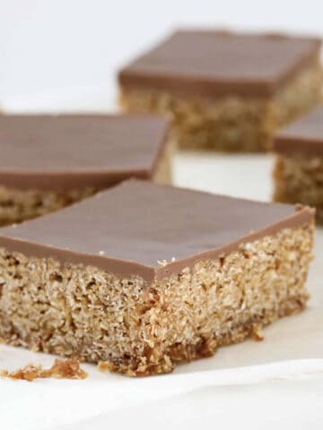 Pieces of oat slice topped with chocolate.